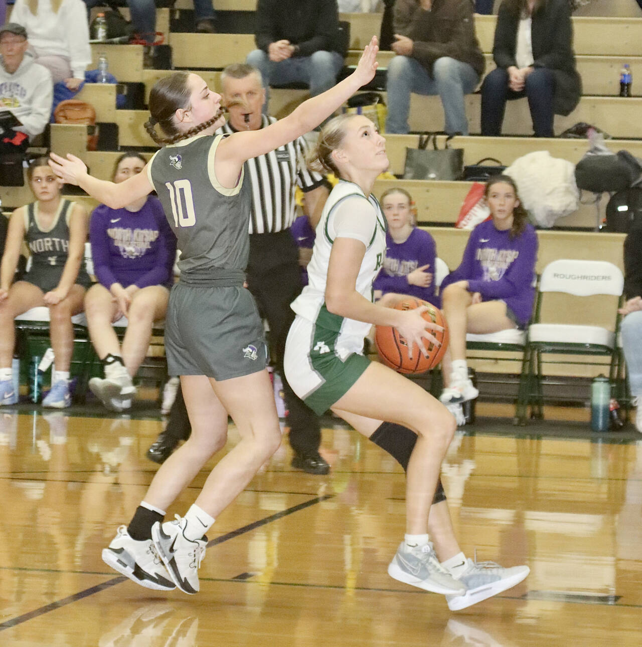 Port Angeles’ Teanna Clark goes up for a basket against North Kitsap in Port Angeles on Tuesday. Clark had a solid game with 14 points, five assists and four steals in a 53-28 Roughriders victory. (Dave Logan/for Peninsula Daily News)