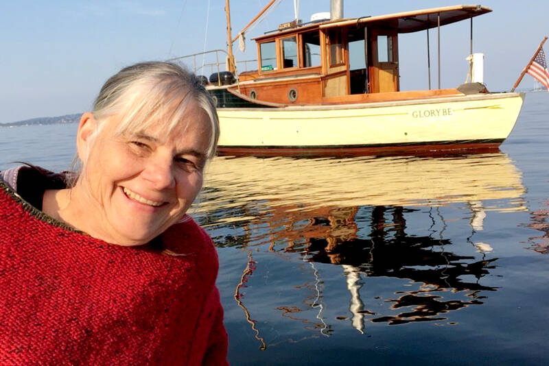 Betsy Davis, the executive director of the Northwest School of Wooden Boatbuilding, with her 1914 wooden boat “Glory Be.” (Northwest School of Wooden Boatbuilding)