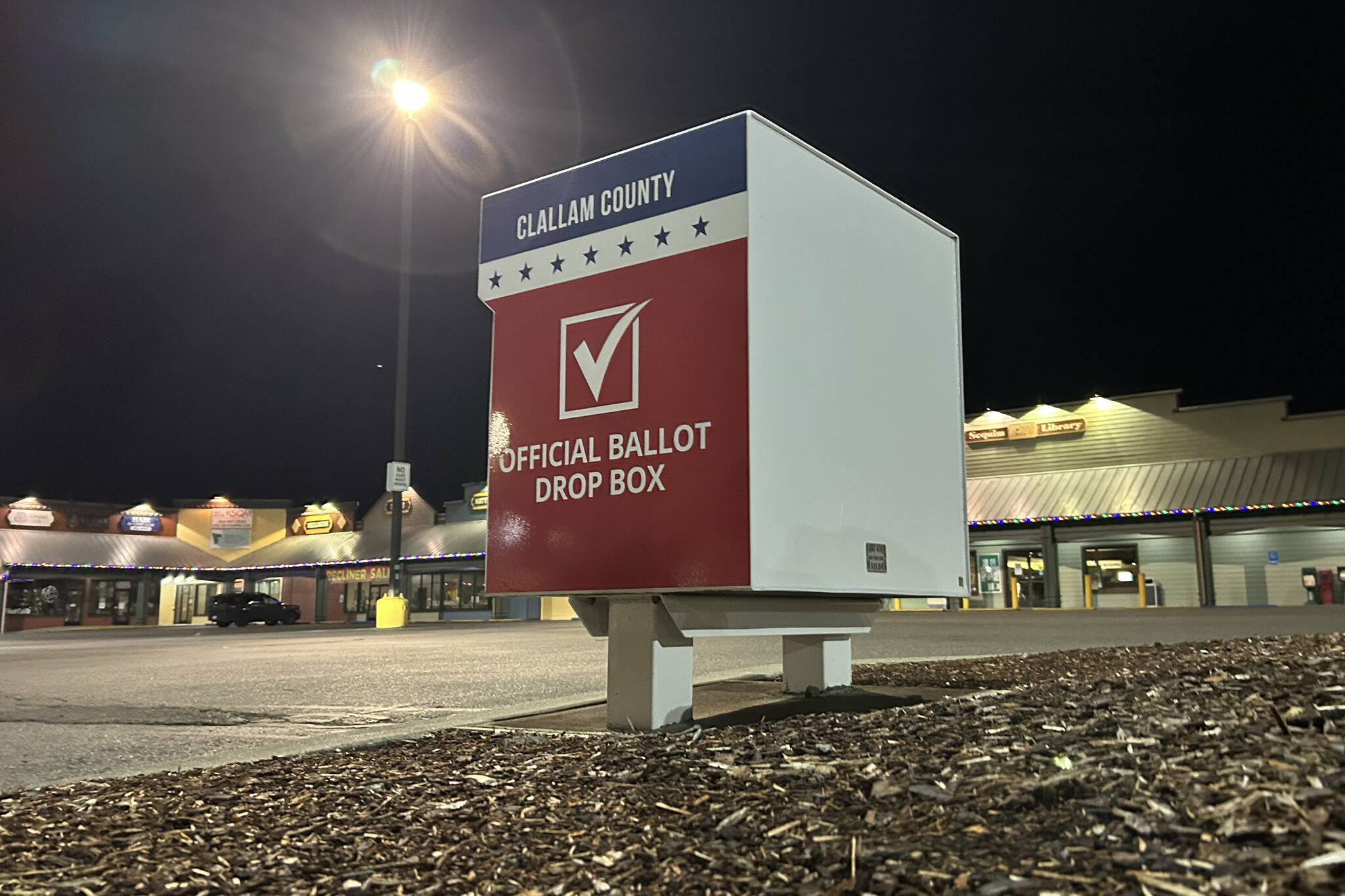 A ballot box in the Sequim Village Shopping Center at 651 W. Washington St. now holds two fire suppressant systems to prevent fires inside after incidents in October in Vancouver, Wash., and Portland, Ore. A second device was added by Clallam County staff to boxes countywide to safeguard ballots for all future elections. (Matthew Nash/Olympic Peninsula News Group)