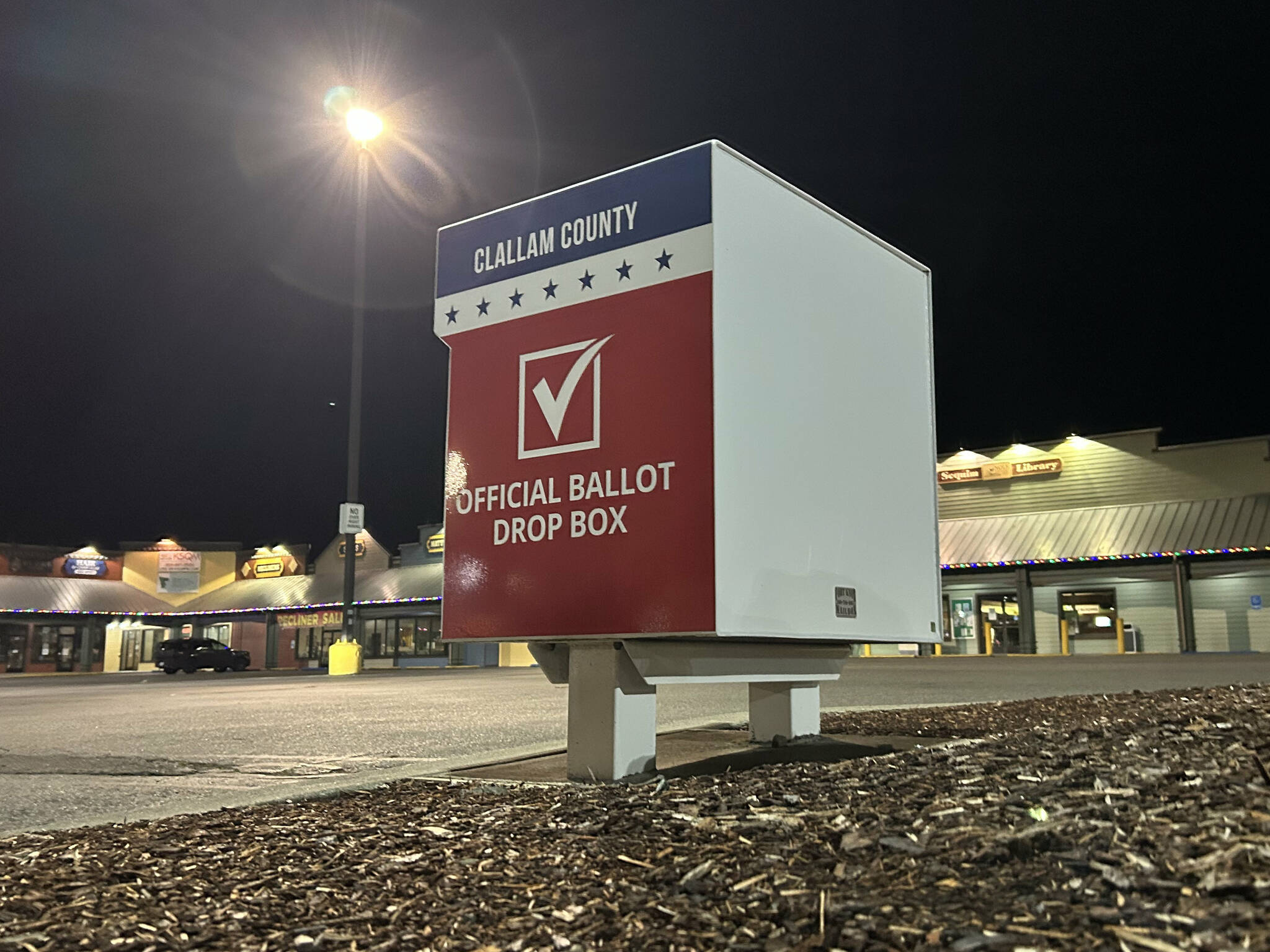 A ballot box in the Sequim Village Shopping Center at 651 W. Washington St. now holds two fire suppressant systems to prevent fires inside after incidents in October in Vancouver, Wash., and Portland, Ore. A second device was added by Clallam County staff to boxes countywide to safeguard ballots for all future elections. (Matthew Nash/Olympic Peninsula News Group)