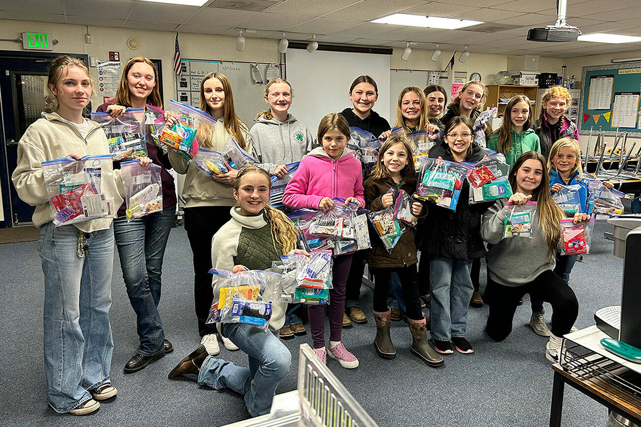 Photos by Katie Salmon

 

Cutline: Just look at those smiling and happy faces of the Neon Riders 4-H horse group as they hold up their completed community service projects — care packages filled with personal hygiene items (toothpaste/brushes/shampoo) along with snacks, colored markers and coloring books for children — they gave to organizations helping recently displaced families