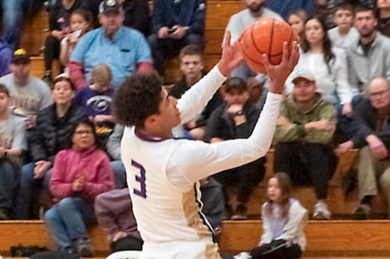 Sequim’s Solomon Sheppard goes up for a basket against W.F. West on Saturday. Sheppard had 11 points, two slam dunks, a 3-pointer and a blocked shot all in the first quarter, as the Wolves won to improve to 6-0. (Emily Matthiessen/Olympic Peninsula News Group)