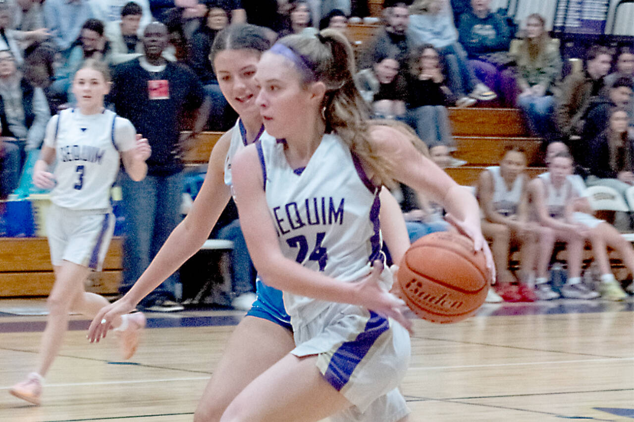 Sequim's Hailey Wagner drives against Bellerine Select, a team from outside of Melbourne, Australia, on Monday in Sequim. Wagner had nine rebounds as Sequim played the Australians tough in a 54-52 loss. (Emily Matthiessen/Olympic Peninsula News Group)