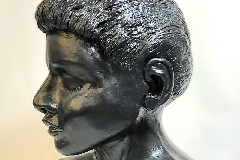 “Young Woman,” a pottery bust by Janet Piccola is on exhibit during the First Friday Art walk