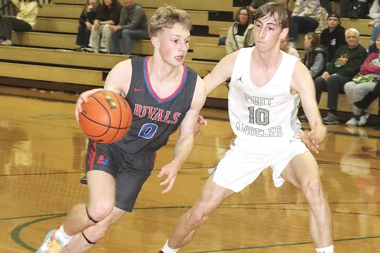 East Jefferson's Rene Martin drives the ball against the defense of Port Angeles' Keatyn Hoch on Tuesday night in Port Angeles. The Roughriders won 76-26. (Dave Logan/for Peninsula Daily News)