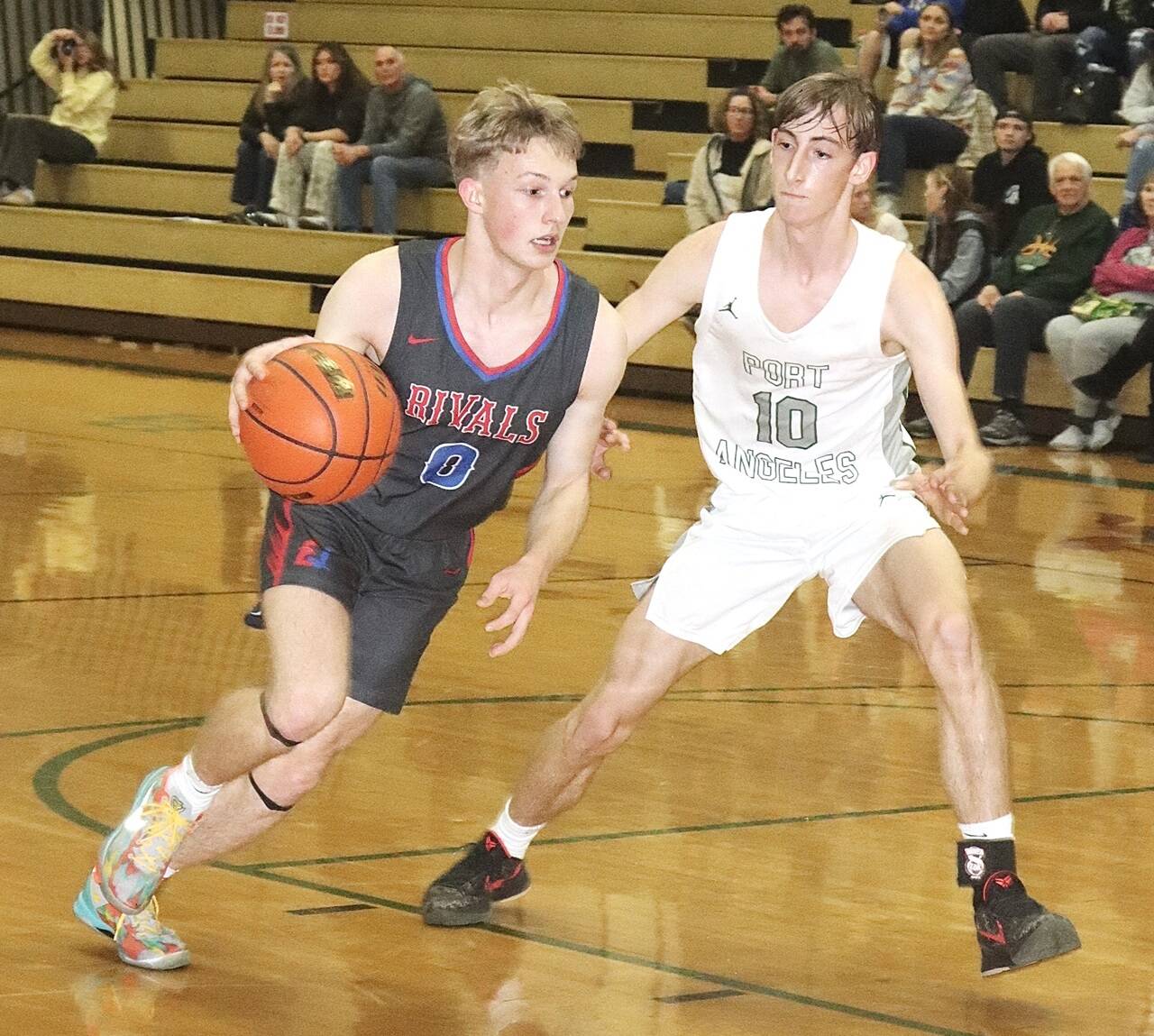 East Jefferson’s Rene Martin drives the ball against the defense of Port Angeles’ Keatyn Hoch on Tuesday night in Port Angeles. The Roughriders won 76-26. (Dave Logan/for Peninsula Daily News)