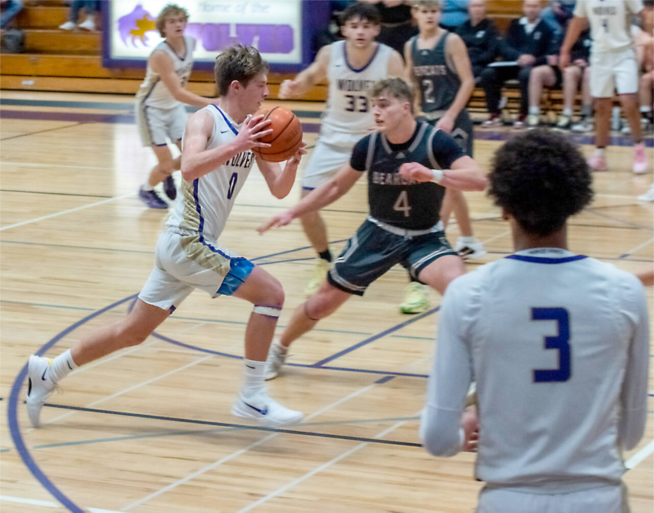 Ethan Melnick of Sequim (0) drives against W.F. West late last year. Also in on the play are Solomon Sheppard (3) and Jamison Gray (33). (Emily Mathiessen/Olympic Peninsula News Group)