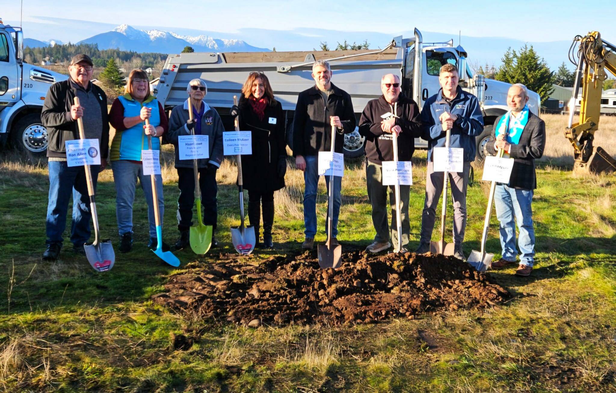 Stakeholders and community leaders stand together for the ceremonial groundbreaking of Habitat for Humanity of Clallam County's Lyon's Landing property in Carlsborg on Dec. 23. (Habitat for Humanity of Clallam County)