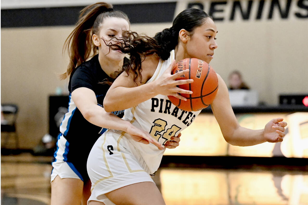 Peninsula College's Shania Moananu (24) drives past the defense of an Edmonds player Saturday in Port Angeles. Peninsula won 87-59 to improve to 11-2 on the season. (Jay Cline/Peninsula College)