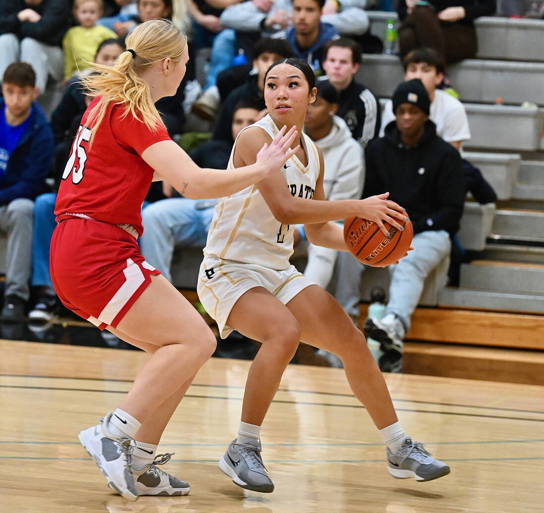 Jay Cline/Peninsula College Athletics 
Carliese O’Brien shields the ball from Skagit Valley’s Paige Mason while looking for a teammate during the Pirates’ 66-62 win over the Cardinals. Mason is a 2024 Port Angeles High School graduate.