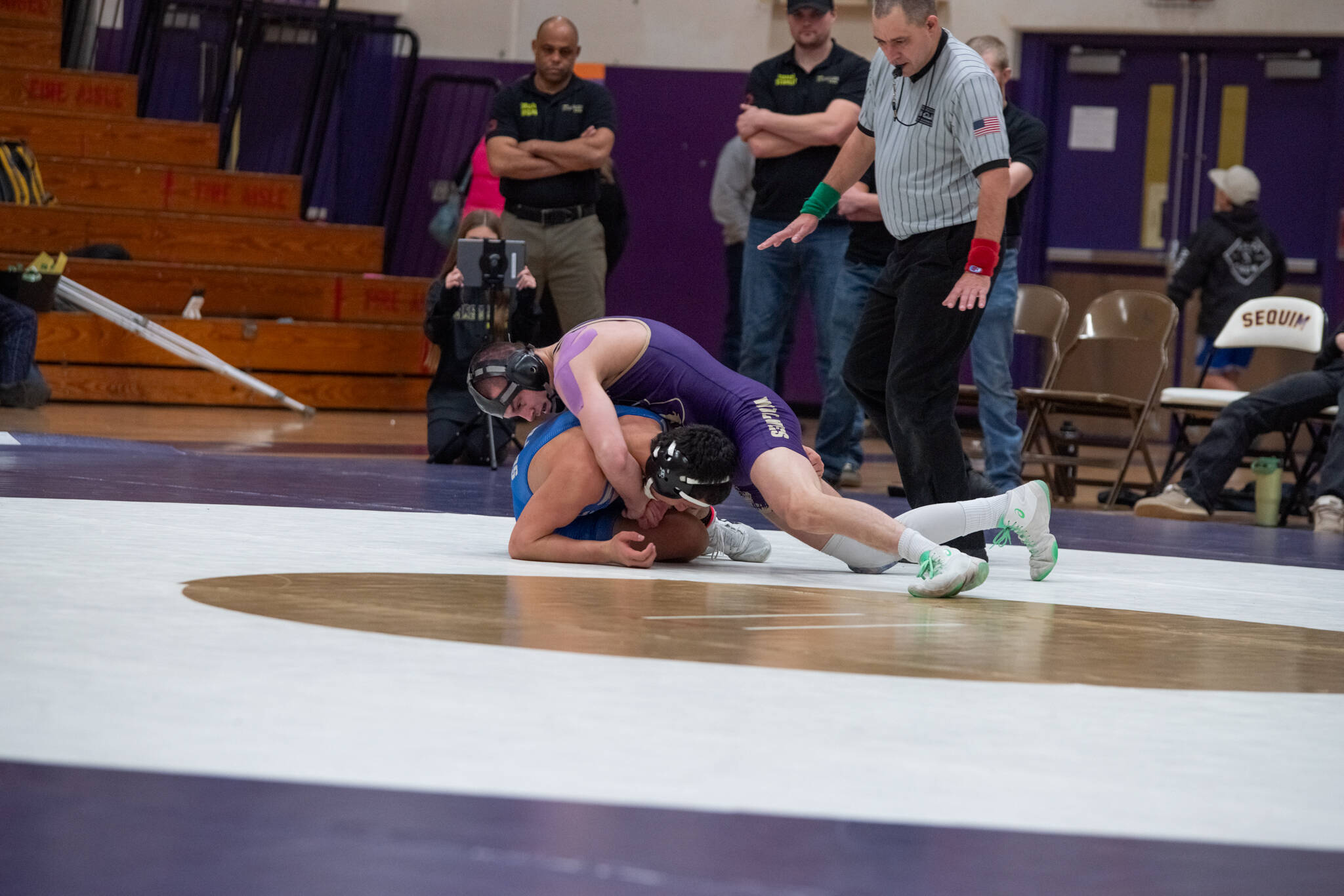 Emily Matthiessen/Olympic Peninsula News Group 
Sequim’s Jayms Vilona controls his Olympic opponent on the way to a 19-3 technical fall victory in the Wolves’ dual-meet victory over the Trojans.