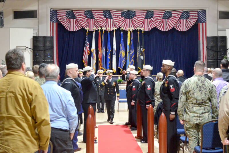 Commander R.J. Jameson, center, exits the change of command ceremony following his assumption of the role on Friday at the American Legion Hall in Port Townsend. (Elijah Sussman/Peninsula Daily News)