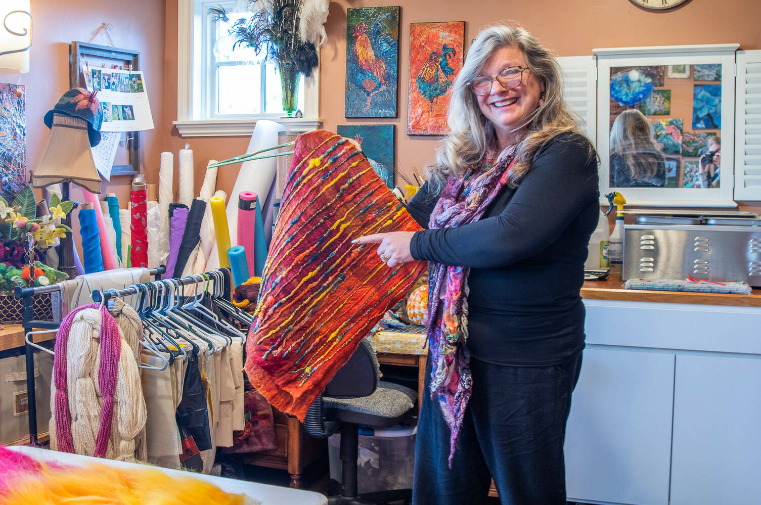 In her wet felting studio, Sequim artist Lora Armstrong explains how ruching happens in felt work. (Emily Matthiessen/Olympic Peninsula News Group)