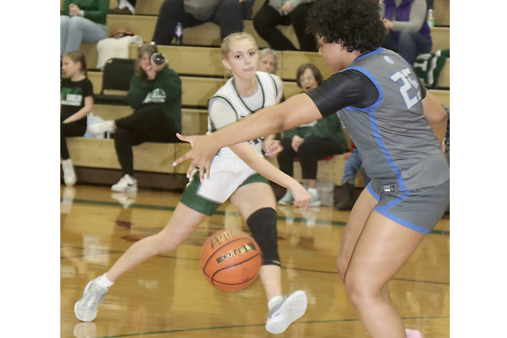 Port Angeles’ Teanna Clark passes the ball against Olympic on Friday night. The Roughriders girls pulled off the unusual feat of winning two games in one night. (Dave Logan/for Peninsula Daily News)