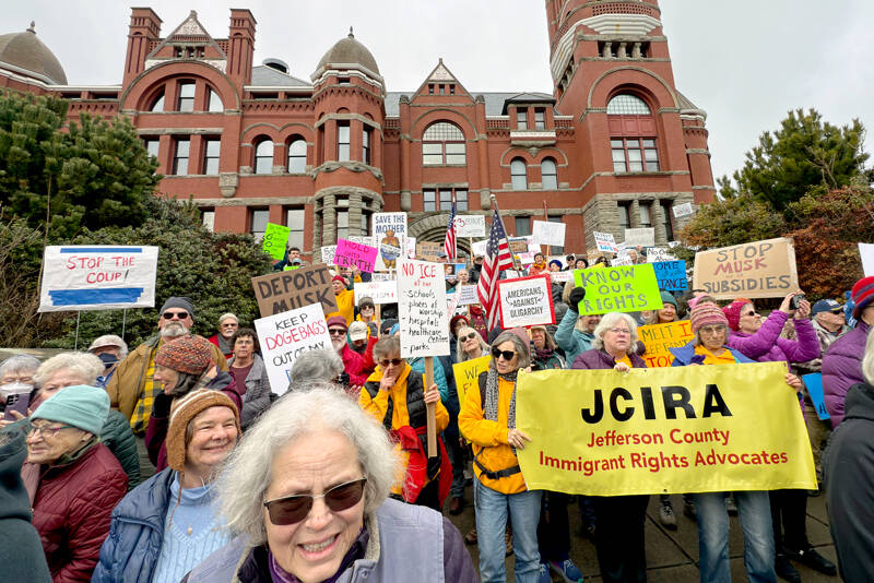 About 700 people from Jefferson and Clallam counties spill out from the steps of the Jefferson County Courthouse onto Jefferson Street in Port Townsend on Monday to take part in a National Day of Protest organized by the 50501 Movement, which stands for “50 protests, 50 states, 1 movement.” (Steve Mullensky/for Peninsula Daily News)