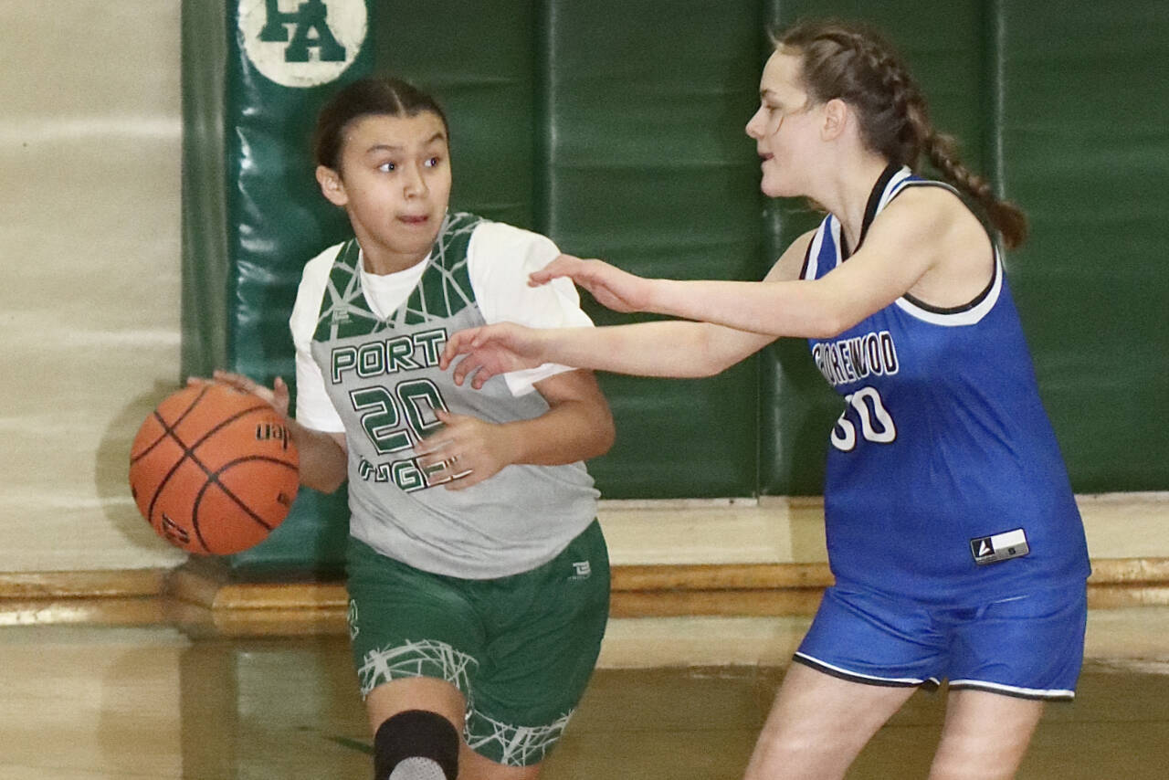 The President’s Day Basketball Youth Tournament was held this weekend in Port Angeles with 40 teams coming from as far away as Elma, Sedro-Woolley, Belfair and Forks. Boys and girls teams had players in grades four through eight. Here, KaLeah Quilt of the seventh-grade Port Angeles girls team dribbles up the court against Shorewood. Shorewood won 22-21 on a last-second shot. (Dave Logan/for Peninsula Daily News)