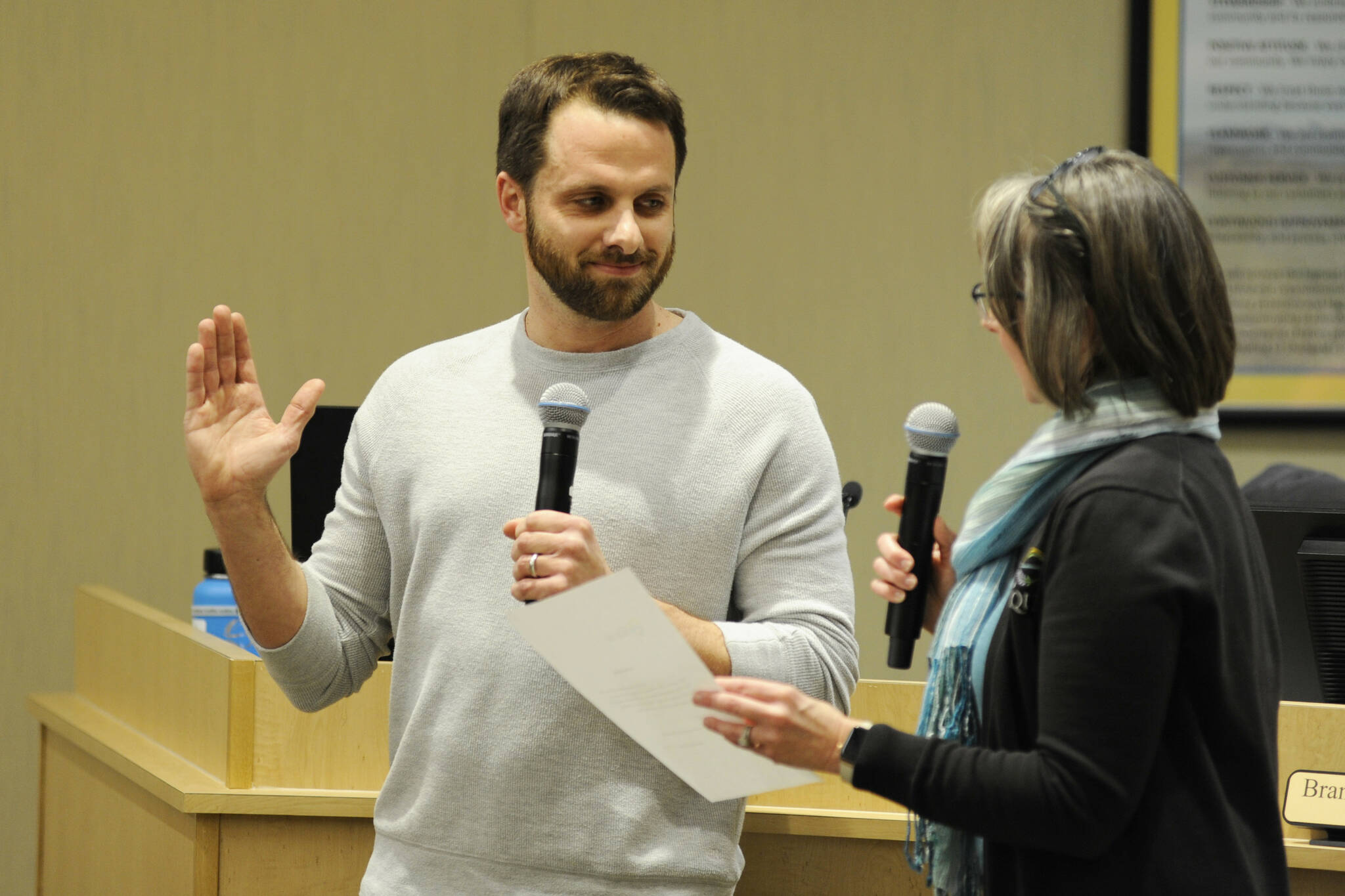 Sequim City Council member Kelly Burger takes the oath of office from City Clerk Heather Robley on Feb. 10 after council members voted to appoint him to replace Kathy Downer. (Matthew Nash/Olympic Peninsula News Group)