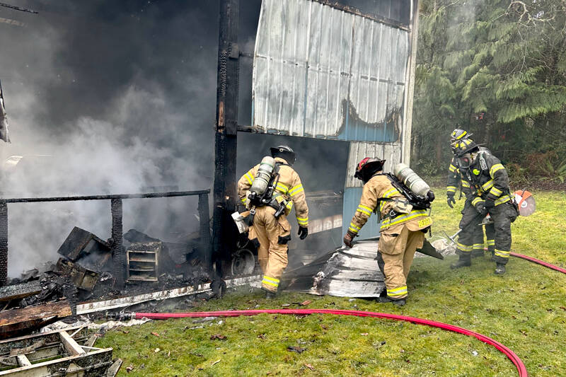 East Jefferson Fire Rescue firefighters work to extinguish a structure fire on Tuesday near the intersection of Lupine and South Jacob Miller roads. (East Jefferson Fire Rescue)