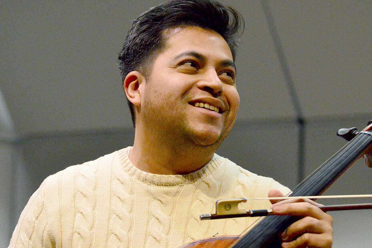 Cellist Gregorio Nieto, pictured rehearsing with the Port Angeles Symphony in December, will return for a gala concert with the orchestra March 15 at Field Arts & Events Hall. (Diane Urbani de la Paz/For Peninsula Daily News)