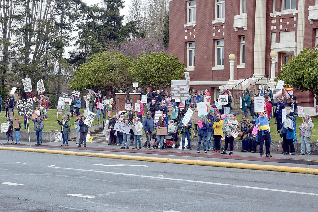 Part of a crowd of nearly 200 people gathers in front of the Clallam County Courthouse in Port Angeles on Saturday for International Women’s Day. The gathering was one of numerous events around the world honoring women and their contributions to global society. (Keith Thorpe/Peninsula Daily News)