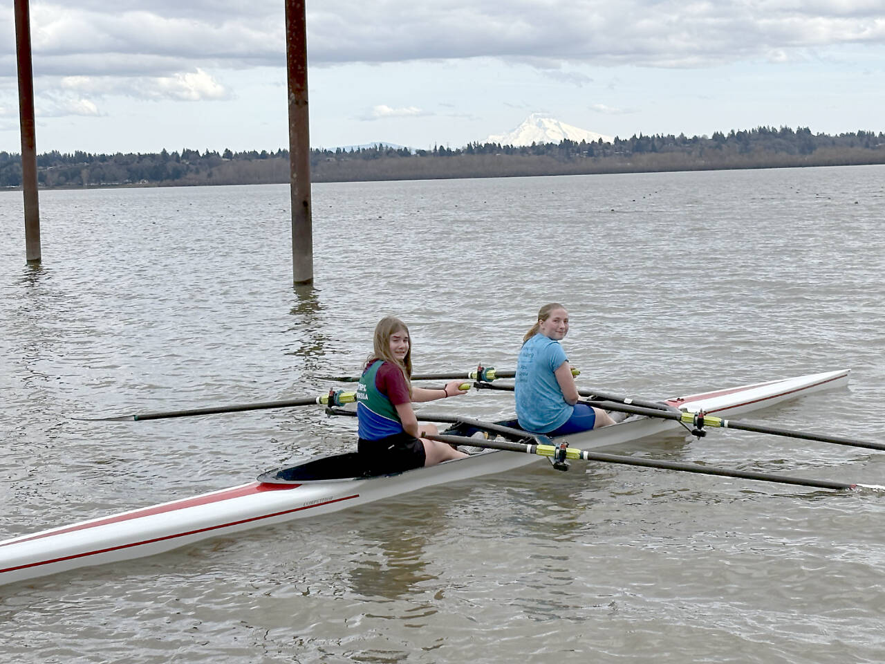 From left, Mariah Disque and Kadence Greul of the Olympic Peninsula Rowing Club competed in the women’s Jr. U17 doubles boat at Vancouver Lake this weekend. (OPRA)